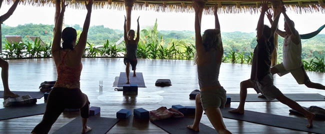 Participants are practicing warrior pose in Costa Rica Yoga Spa