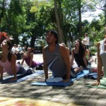 group of people practicing outdoor yoga