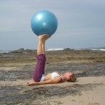 woman doing pilates with ball