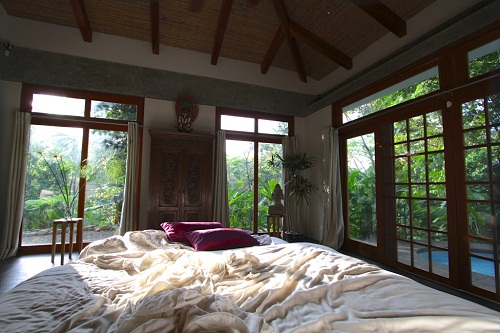 A scatterred bed in the guest villa