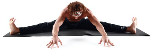 male yogi doing intense streching