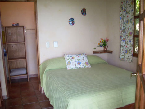 provate room with queen size bed at Panacea de la Montaña